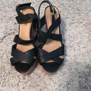 Black pleather and corkscrew wedges